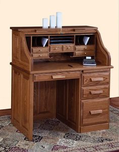 a wooden desk with drawers on top of it