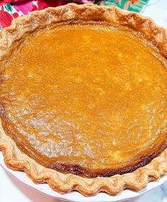 a pie sitting on top of a white plate