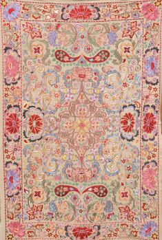 an antique rug with floral designs on it