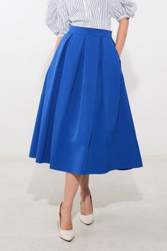 A solid woven full skirt with side zipper closureDetails:Self : 100% PolyesterSize & Fit- Model is 5`9" And Wearing Size Small- Measurements Taken From Size Small- Approx. Length: 35" Blue A-line Bottoms With Pockets, Solid Color Full Pleated Skirt For Work, Chic Full Pleated Skirt In Solid Color, Chic Solid Color Full Pleated Skirt, Spring Blue Voluminous Skirt, Blue Summer Skirt For Work, Blue Pleated Waist Flared Skirt, Blue Summer Workwear Skirt, Blue Skirt For Summer Workwear