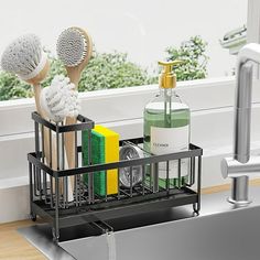 a kitchen sink with soap, toothbrushes and other bathroom items in the holder