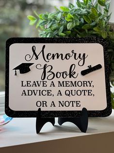 a sign that says memory book leave a memory advice, a quote or a note