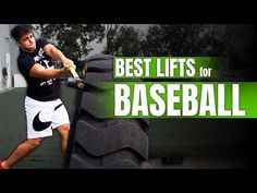 a man hitting a ball with a tennis racquet on top of a tire