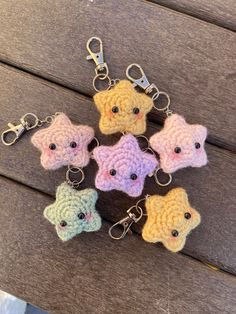 small crocheted keychains are arranged in the shape of stars