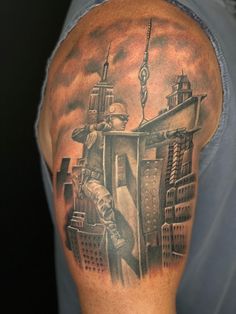 a man with a cityscape tattoo on his arm