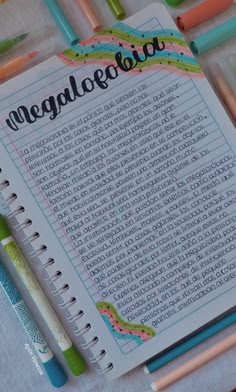 a notebook with the word megalogia written in cursive writing