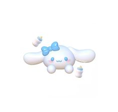 an animal shaped object with a blue bow on it's head and legs, sitting in front of a white background