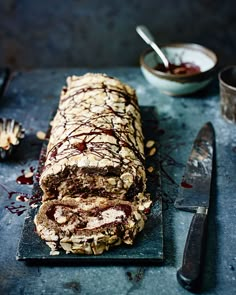 a loaf of chocolate and almond bread on a cutting board