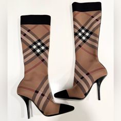 Tried On Only,Like New Condition. Size 39.5 Burberry Beige Check Stretch Knit Sock Boots Knee-High Stretch Knit Boots In Beige Featuring Signature Check Pattern In Black, Red, And White Throughout. Rib Knit Trim In Black At Square Toe And Collar. Knit Stripe In Black At Heel. Covered Stiletto Heel In Black. Leather Sole In Black. Approx. 4" Heel. Supplier Color: Archive Beige Upper: Textile. Sole: Leather. Made In Italy. Luxury Brown Formal Knee-high Boots, Luxury Brown Knee-high Heeled Boots, Burberry Plaid Heels, Burberry Sneakers & Athletic Shoes, Luxury Brown Knee-high Boots With Reinforced Heel, Knit Boots, Burberry Shoes, Check Pattern, Shoes Heels Boots