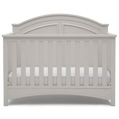 a white crib with no mattresses on the top and bottom rails, in front of a white background