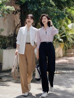 two women walking down the street together