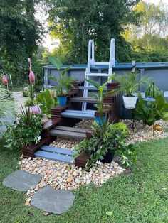 a garden with steps and plants in it