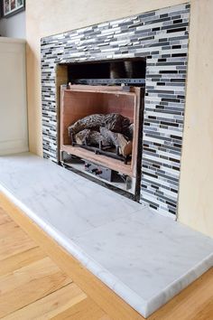 a fireplace with the words how to tile a fireplace in it and an image of a fire place