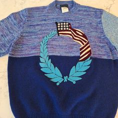 Vintage Gianni Versace Sweater In Pristine Condition. Unisex, Size Iv/ 50. Made In Italy With A Blend Of 75% Lambswool, 10% Cashmere, 10% Silk, 5% Angorawool. Crew Neckline, Embroidered American Flag. Beautiful Hand. Measures 21" From Pit To Pit And 25" From Back Collar Seam To Hem. Blue Wool Knit Sweater, Blue Knitted Wool Tops, Retro Blue Knit Sweater, Blue Retro Knit Sweater, Blue Fitted Wool Sweater, Fitted Blue Wool Sweater, Versace Sweater, Sweaters Vintage, Versace Blue