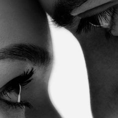 a man and woman are looking at each other with their eyes close to one another