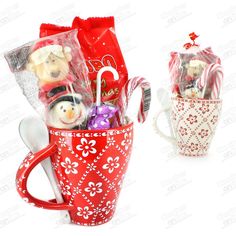 two mugs filled with candy and candies on top of each other in front of a white background