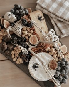 a table topped with halloween food and decorations