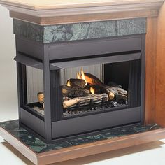 a wood burning fireplace with logs in it