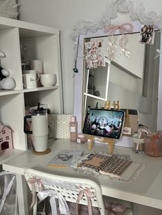 a white desk topped with a computer monitor