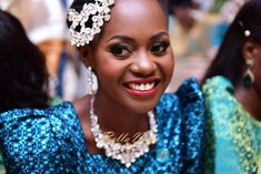 a woman wearing a tiara and smiling at the camera