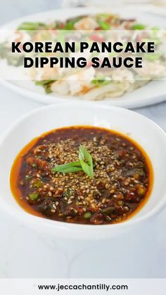 korean pancake dipping sauce in a white bowl on a table with other dishes