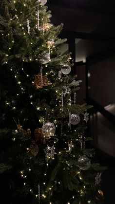 a christmas tree with lights and ornaments on it