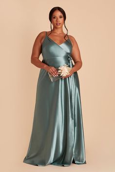 This satin wrap dress is an absolute stunner. Any bridesmaid will love how our Cindy dress flatters, emphasizing her natural waistline and elongating her frame. Perfect for a formal affair, our shimmering satin amps up the glam. The sky's the limit when it comes to accessorizing Cindy. She pairs beautifully with dangly earrings or a dramatic statement necklace.  Cindy Shiny Satin Dress - Sea Glass Sea Glass Bridesmaid, Cindy Dress, Satin Gowns, Satin Wrap Dress, Birdy Grey, Plus Size Bridesmaid, Green Bridesmaid Dresses, Bridal Party Dresses, Bridesmaid Dresses Plus Size