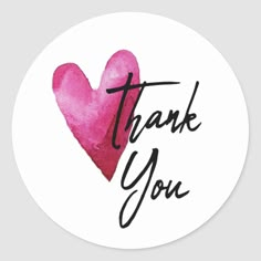 a pink heart with the words thank you in black ink on a white round sticker