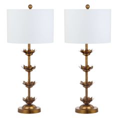 a pair of lamps with leaves on them