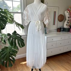 Vintage Nwt Val Mode Peignoir Robe Captiva Nylon Sheer Ivory Size Medium 70s/80s This Dreamy Piece From Val Mode Is New With Its Original Tags. So Romantic And Ethereal - Would Be So Stunning For Bridal Wedding Night Lingerie. Long Dressing Gown In Sheer Ivory Nylon With Satin Belt And Lace Trim On The Sleeves. Tag Size Medium. The Distance Form Out To Pit, Measured Across The Back Of The Robe, Is Approximately 27". Shoulder To Hem Is Approximately 57". Please See Photos For Details On The Beaut Bridal Loungewear, Vintage Dressing Gown, Terry Cloth Bathrobe, Terry Cloth Robe, Wedding Night Lingerie, Satin Coat, Embroidered Robes, Sheer Robe, Satin Belt