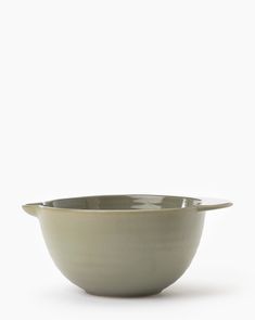 a white bowl sitting on top of a table