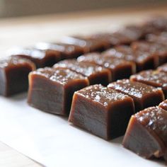 pieces of chocolate sitting on top of a white plate