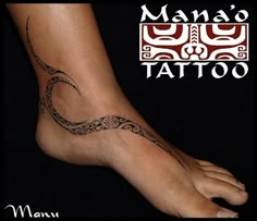 a woman's foot with a tattoo design on the top and bottom of it