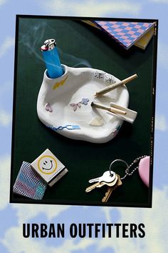 an advertisement for the urban outfitters, featuring various items on a plate and keychain