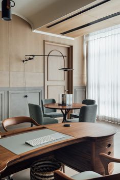 a wooden table sitting in front of a window