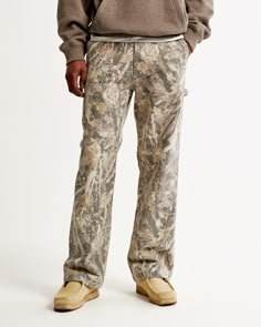 Elevate your workwear game with the Abercrombie & Fitch Men's Baggy Workwear Pant in a striking camo print. Designed for both style and function, these pants are a must-have for any fashion-forward wardrobe.

- **Size**: 32 X 28
- **Material**: Main fabric is a durable stretch canvas; Pocket bag made from polyester and cotton blend
- **Color**: Camo
- **Gender**: Male
- **Features**: Carpenter-style details including a hammer loop, wider belt loops, and back patch pockets. Button and fly closure Camo Pants Outfit Men, Camo Pants Men, Camo Pants Outfit, Camouflage Jeans, Abercrombie Men, Nyc Outfits, Guy Fits, Pants Outfit Men, Camo Jeans