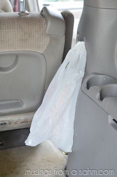 there is a plastic bag in the back seat of a car