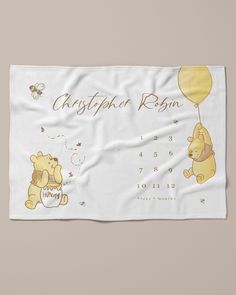 the winnie the pooh baby blanket is shown with its name and date on it