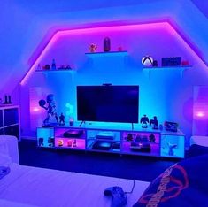 a living room with purple and blue lighting