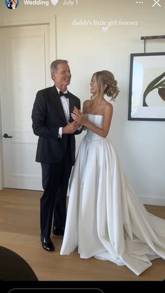 a man in a tuxedo standing next to a woman in a wedding dress