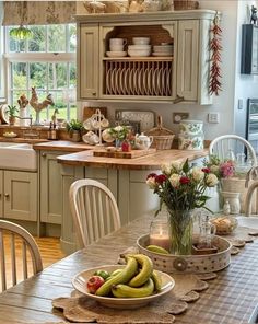 a kitchen filled with lots of counter top space and wooden furniture next to a window