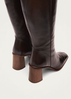 Brown leather knee-high boots with block heel A classic in our collection, the Est boots are shaped from brown leather to a knee-high silhouette, featuring a squared toe and block heel, and benefiting from a functional side-zip fastening Brown Leather Knee High Boots, Sustainable Leather, High Knees, Coffee Brown, Brown Leather Boots, Beauty Bag, Tall Boots, Active Wear Tops, Leather Working