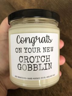 someone is holding a jar of candles that says congrats on your new crott gobblin