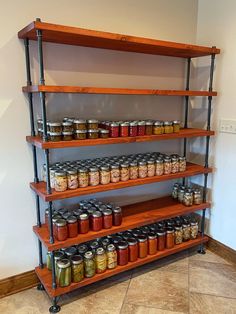 the shelves are filled with jars and spices