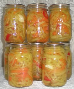 several jars filled with different types of food