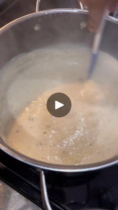 a pan filled with food on top of a stove