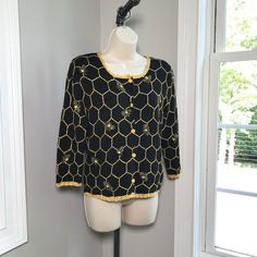 Michael Simon 3/4 Sleeve Black Button Down Cardigan. Women’s Size Small, Round Neck And Embellished With Beaded Bees And Shimmery Gold Honeycomb Pattern. Stunning Gold Color Crocheted Trim. Rich Striking Colors! Beautifully Made As Michael Simon Is So Well Known For. Includes Shoulder Pads. Laying On A Flat Surface Armpit To Armpit Is 18.5” Across. Length From Shoulder To Bottom Hem Is 22.5” And Sleeve Length Is 18”. Excellent Condition And Quality. Comes From A Smoke Free Home And Happy To Comb Honeycomb Crochet Sweater, Beaded Bees, Honeycomb Crochet, Michael Simon, Crochet Cardigan Sweater, Button Down Cardigan, Honeycomb Pattern, Cardigan Women, Cardigan Sweaters For Women