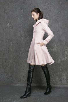 "Keep warm + elegant + stylish in this classic pink wool coat from Xiaolizi. The winter coat made from soft wool material in a fit and flare silhouette. The womens coats topped with a button-down placket + hooded collar. The swing coat finished with ruffle long sleeves + side-entry pockets. ** Detail ** * Wool composition \" 45% wool blend + fiber \" ; An excellent high-quality wool, a beautiful retro wool, The wool itself isn't a thick high end wool but it's very warm and just perfect. Making i Hooded Sweater Coat For Winter, Fitted Pink Wool Outerwear, Pink Fitted Wool Outerwear, Chic Fitted Winter Sweater Coat, Chic Pink Wool Outerwear, Chic Pink Wool Coat, Elegant Pink Pea Coat For Spring, Spring Wool Coat With Stand Collar, Chic Pink Winter Sweater Coat