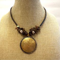 Excellent Condition- Like New. Necklace Measures 15” Plus 2” Extender. Pendant Measures 2 1/4” From Top To Bottom. Brown Faux Leather Chain, Gorgeous Wire Wrapped Glass Beads, And An Antique Gold Hammered Pendant. Nice Necklace! Check Out Other Items In My Closet! Over 3,000 Items- Mostly Jewelry ( But Not All)! Bundle For The Best Discount! ( 20% Off For 2 Or More Items). Questions? Leave A Comment Below! Inv Note:K5767. 240520 Elegant Brown Metal Beaded Necklace, Elegant Adjustable Bronze Beaded Necklace, Adjustable Round Brown Beaded Necklace, Adjustable Brown Beaded Round Necklace, Adjustable Brown Round Beaded Necklace, Adjustable Brown Beaded Necklace, Adjustable Brown Beaded Necklace With Round Pendant, Gold Medallion, Premier Designs Jewelry