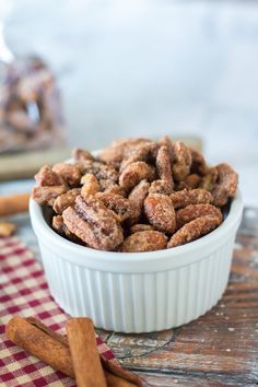 cinnamon sugar nuts in a white bowl on a table